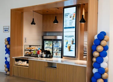 Biz Cafe Biz cafe front counter with UCR colored balloons